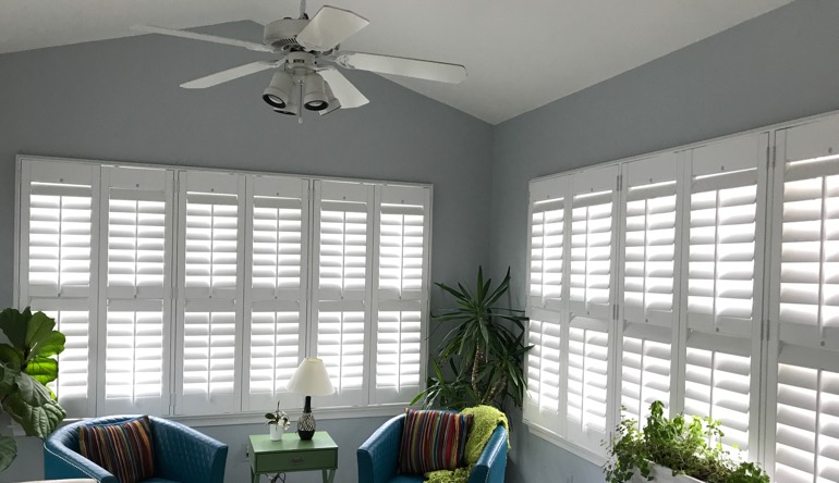 Minneapolis sunroom with fan and shutters